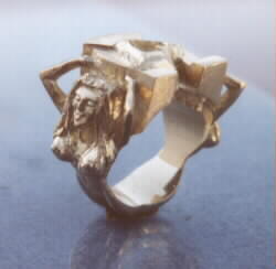 Gold casting of above wax of sex crazed mermaids who are dripping hot while holding a horseshoe that isn't really all that hot but is well executed.